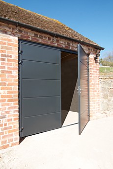 A pair of Carteck Solid Smooth Insulated Side-Hinged garage doors
